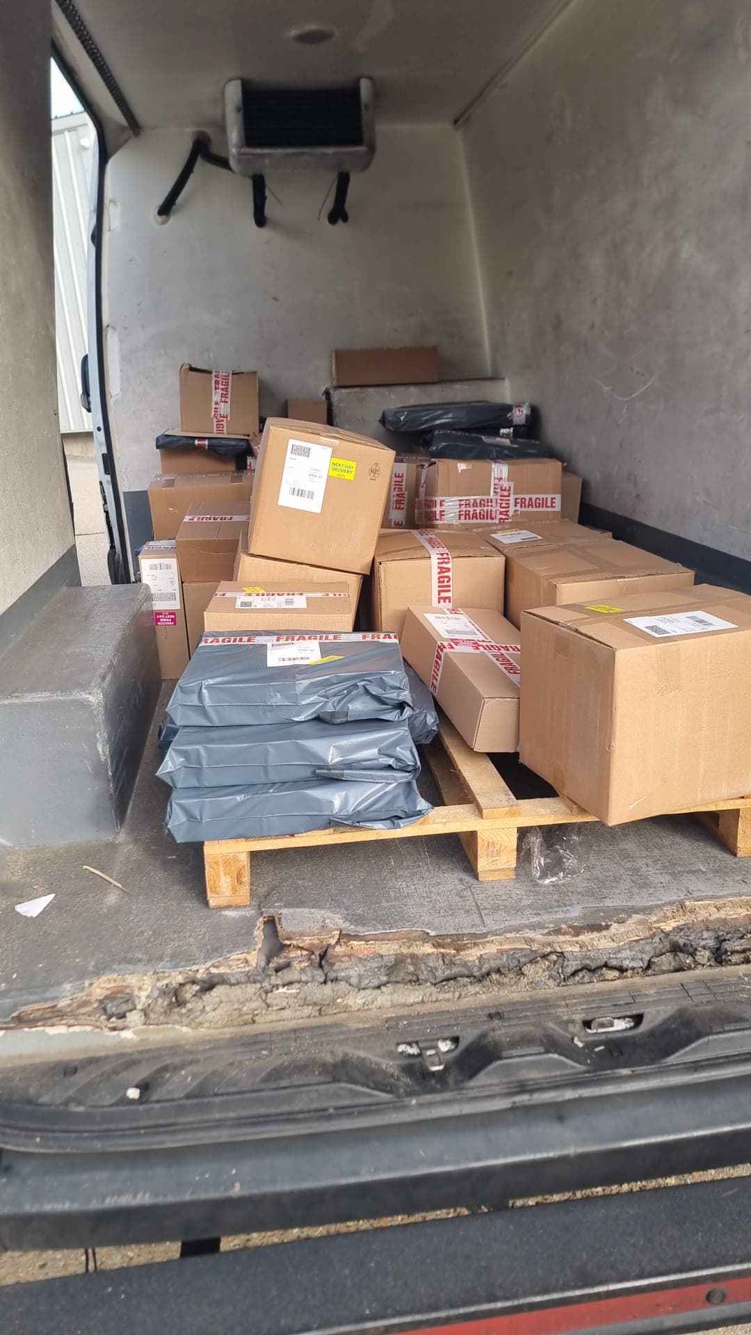 Fragile-marked parcels loaded in a delivery van