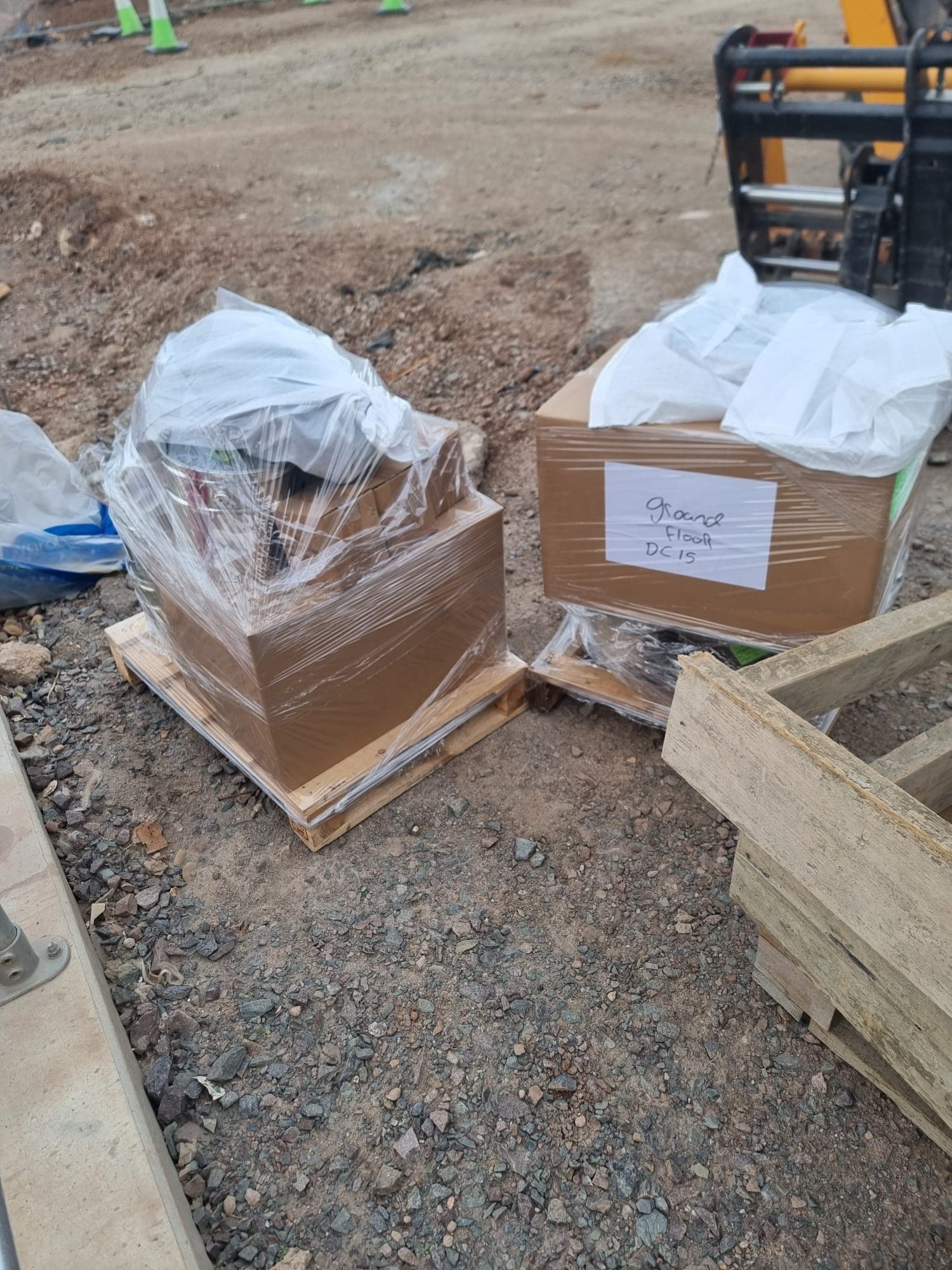 Wrapped pallets staged on a construction site